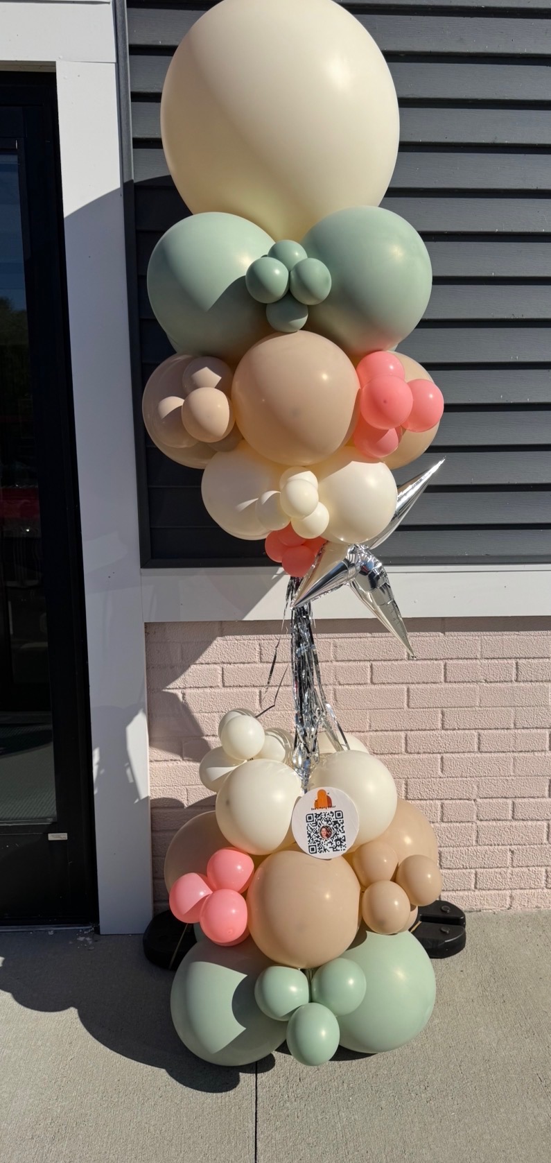 Sage, peach and coral balloon column with silver star accent